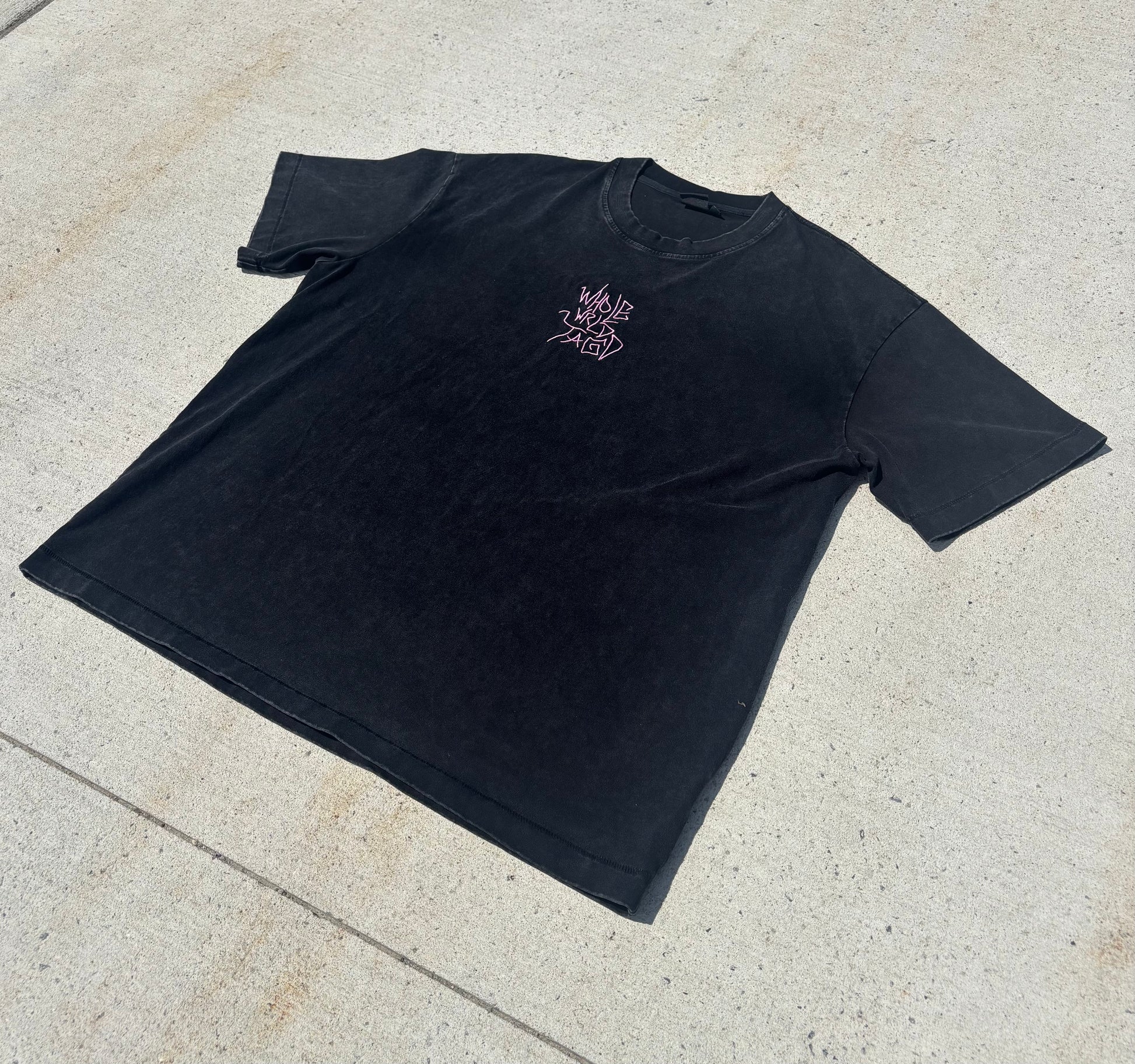 Black Japanese graffiti streetwear t-shirt front view close up